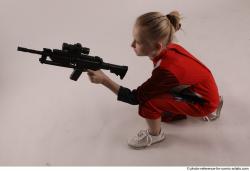 DENISA KNEELING POSE WITH GUN